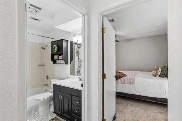 a en suite bathroom with a sink toilet and shower