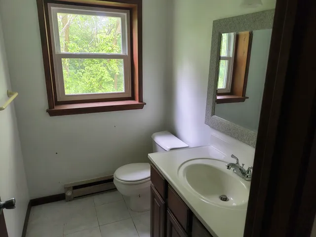 a view of an empty room with a fireplace