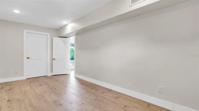 a kitchen with stainless steel appliances white cabinets white stove a microwave and a refrigerator
