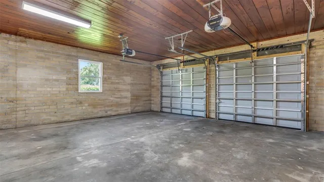 an empty room with windows and entrance