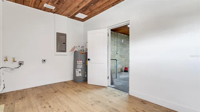 an empty room with windows and entrance