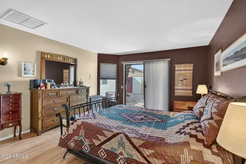 a bedroom with furniture and a wooden floor