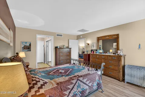 a bed room with a bed and furniture