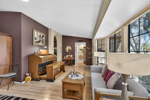 a living room with furniture and a large window