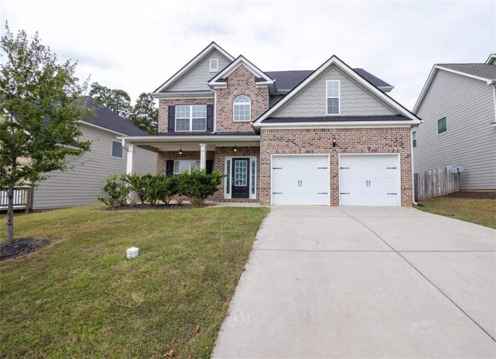 a view of a house with a back yard