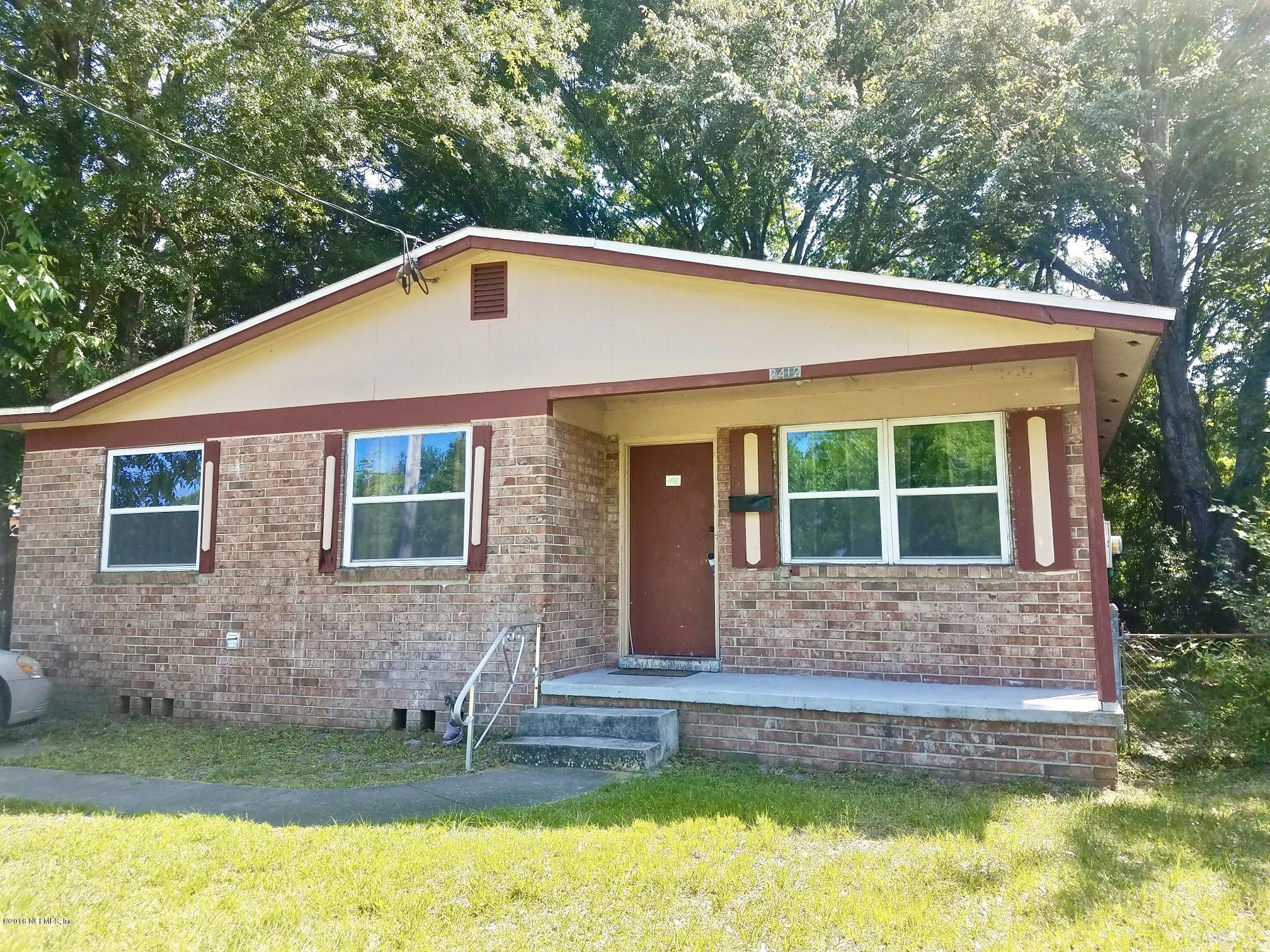 2412 Automobile Drive Jacksonville, FL 32209 - Photo 1 of 10 a front view of a house with a yard