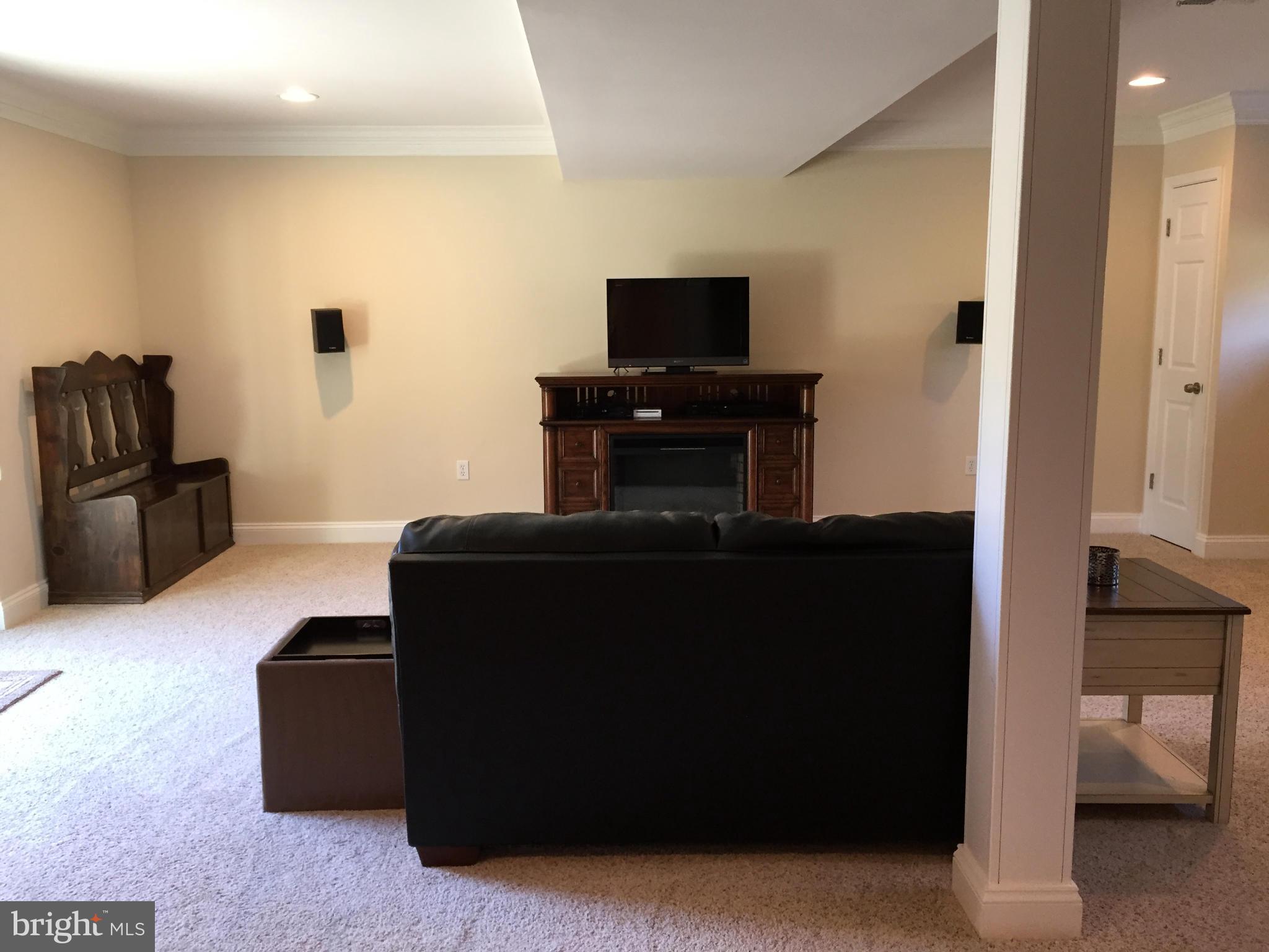 3049 Tudor Hall Road Riva, MD 21140 - Photo 19 of 30 a living room with furniture and a flat screen tv