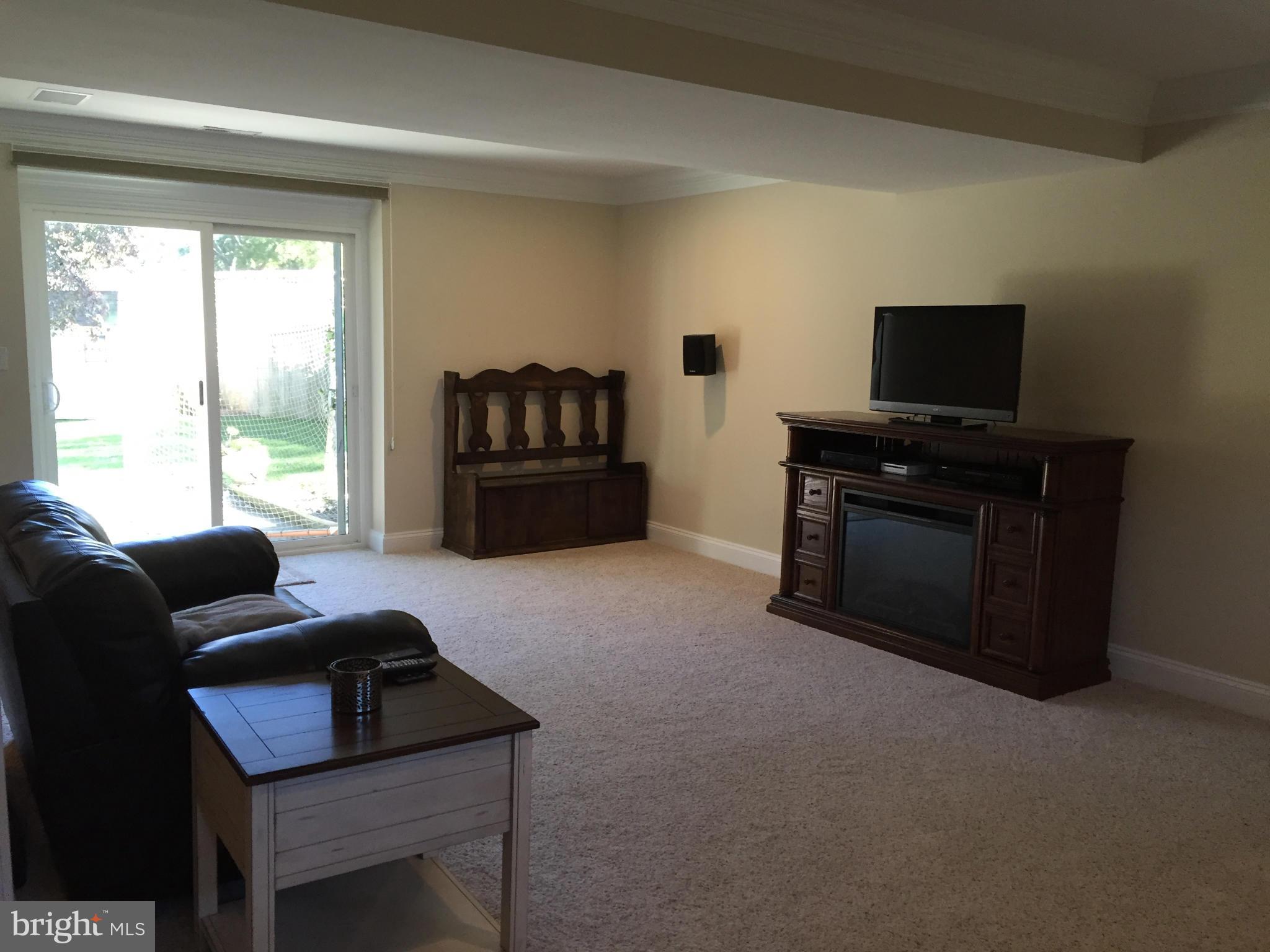 3049 Tudor Hall Road Riva, MD 21140 - Photo 21 of 30 a living room with furniture and a flat screen tv