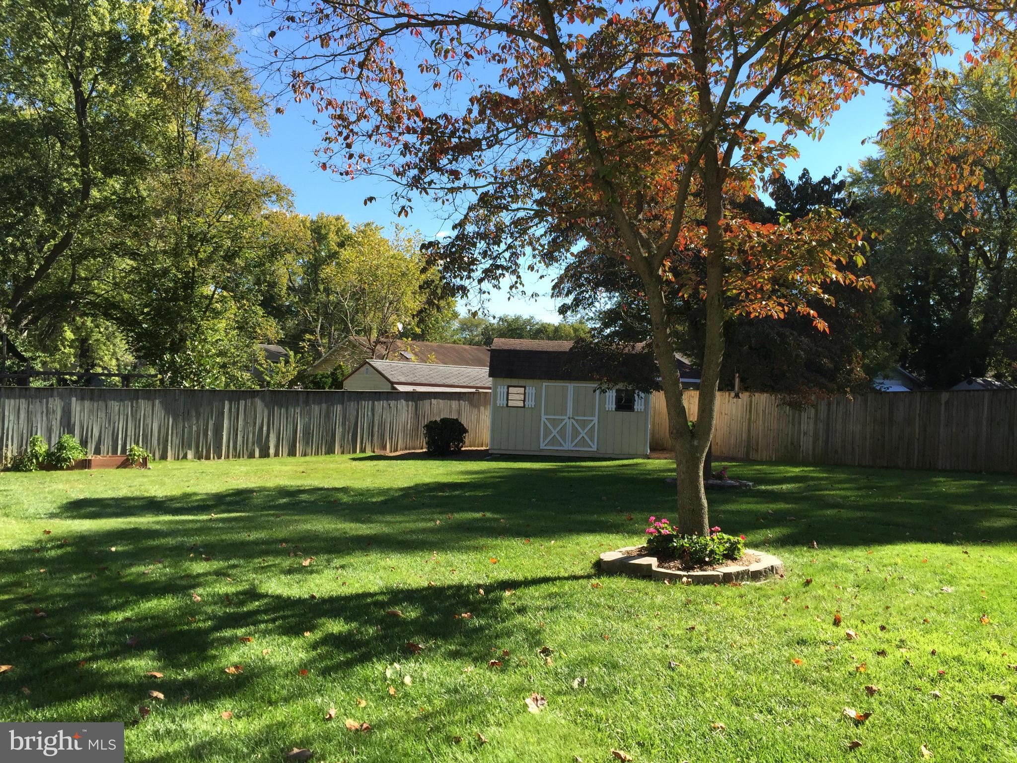 3049 Tudor Hall Road Riva, MD 21140 - Photo 27 of 30 a front view of a house with a yard table and trees