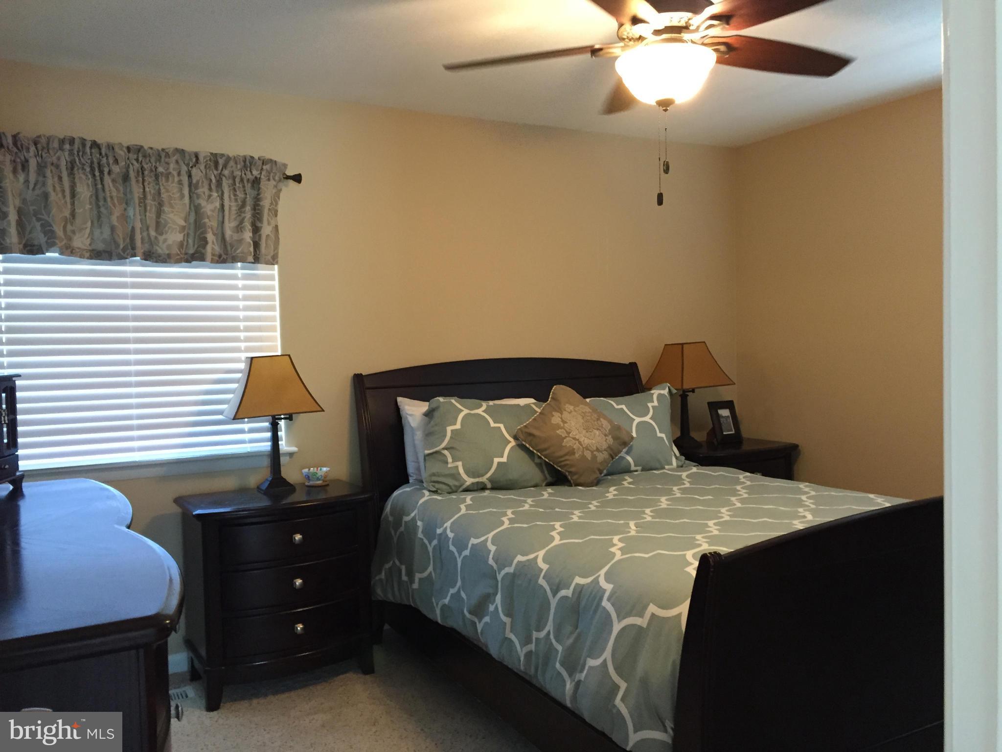 3049 Tudor Hall Road Riva, MD 21140 - Photo 10 of 30 a bedroom with a bed and a chandelier