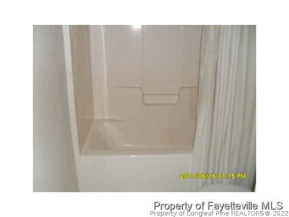 5412 Shaker Heights Lane Raleigh, NC 27613 - Photo 1 of 15 a bathroom with a shower curtain
