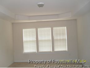 5412 Shaker Heights Lane Raleigh, NC 27613 - Photo 12 of 15 a view of an empty room with a window