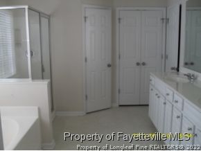5412 Shaker Heights Lane Raleigh, NC 27613 - Photo 13 of 15 a bathroom with a sink and a tub