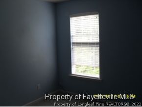 5412 Shaker Heights Lane Raleigh, NC 27613 - Photo 4 of 15 a view of an empty room and window