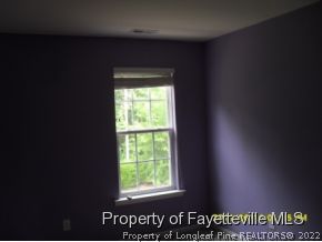 5412 Shaker Heights Lane Raleigh, NC 27613 - Photo 5 of 15 a view of an empty room and window