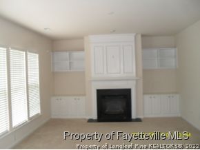 5412 Shaker Heights Lane Raleigh, NC 27613 - Photo 7 of 15 a living room with a fireplace