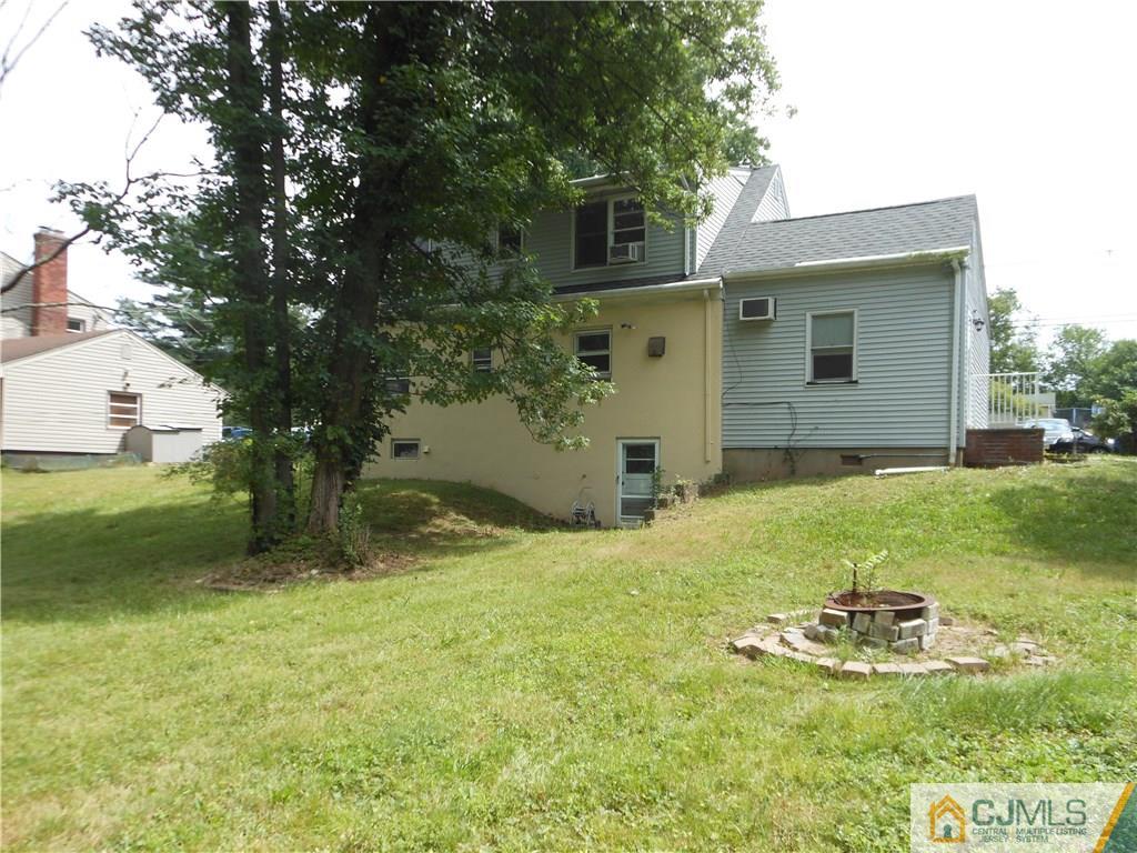 161 Jordan Road Colonia, NJ 07067 - Photo 3 of 15 a backyard of a house with yard and tree