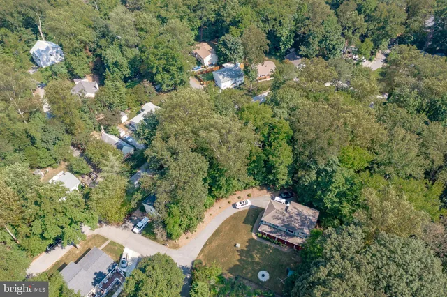 an aerial view of house with yard swimming pool and outdoor seating