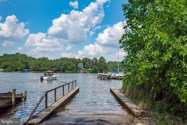a view of a lake with sitting area