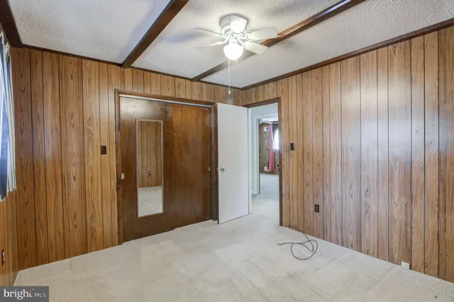 a front view of a house with yard and sitting area
