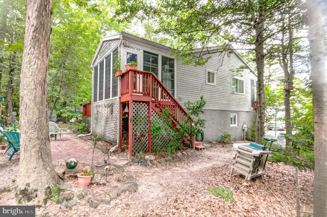 a view of balcony with wooden floor and fence