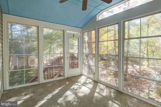 a view of empty room with windows