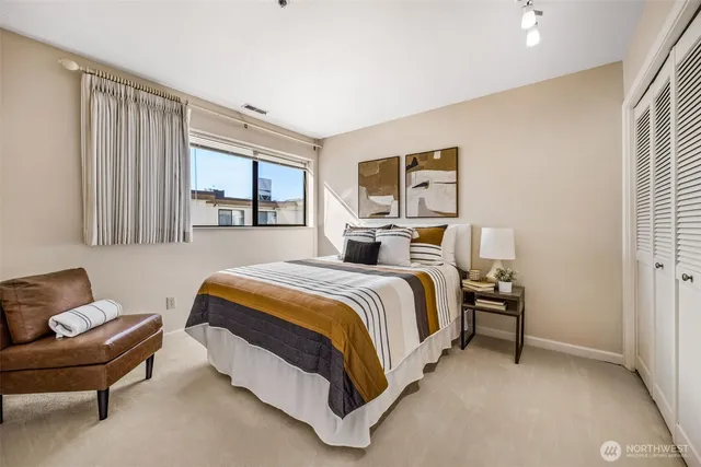 a bedroom with a bed and window