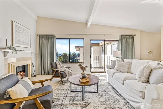 a living room with furniture fireplace and a fireplace