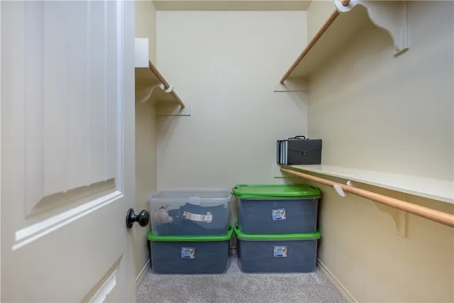 a room with a door and a bed