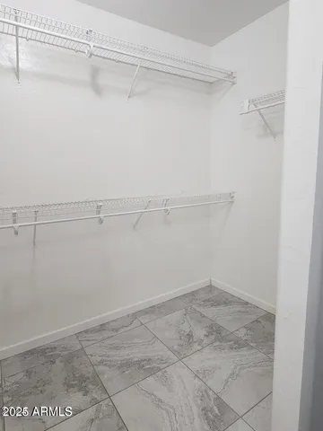 a view of an empty walk in closet
