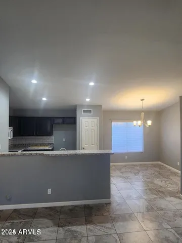 a view of a kitchen with a sink