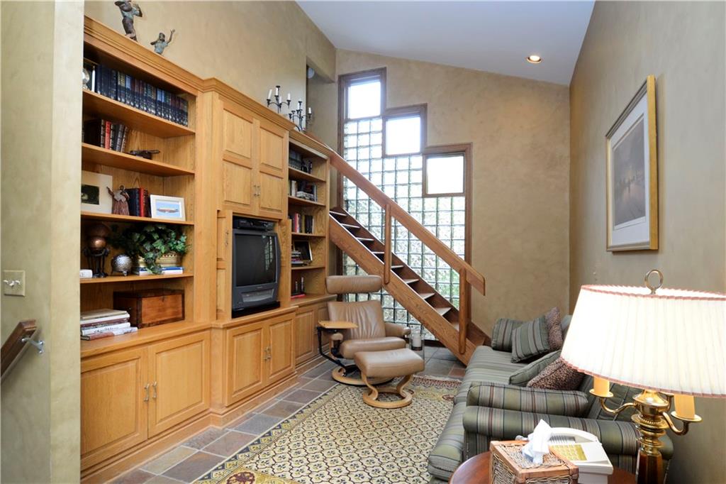 181 Merriman Road Sewickley Heights, PA 15143 - Photo 16 of 25 Private area for TV, bookshelves, cabinetry, stairs to loft and adjacent sitting room.