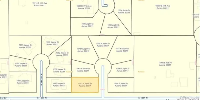 an aerial view of a red and white building