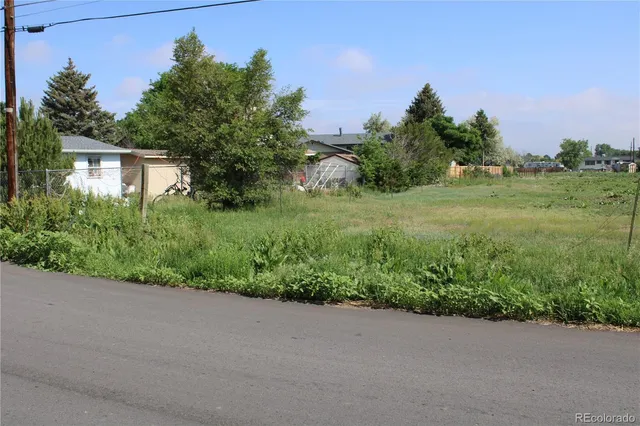 a view of a road with a park