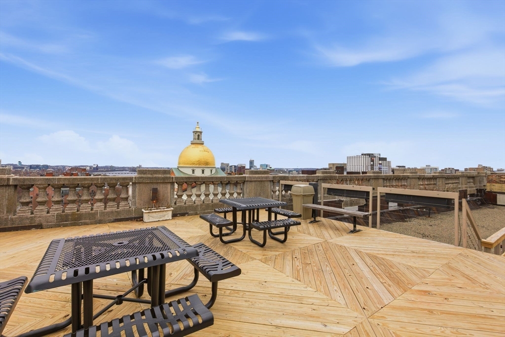 21 Beacon Street, Unit 11L Boston, MA 02108 - Photo 14 of 23 a view of a swimming pool with seating space