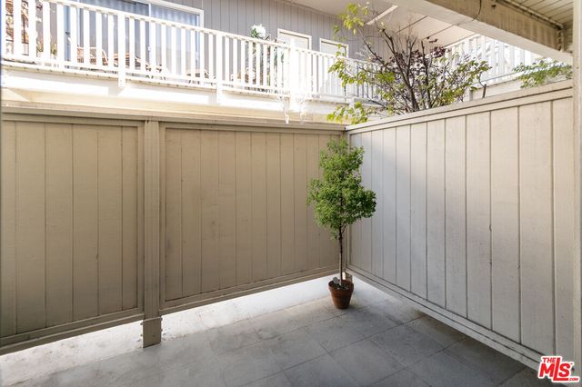 a couple of potted plants in front of door