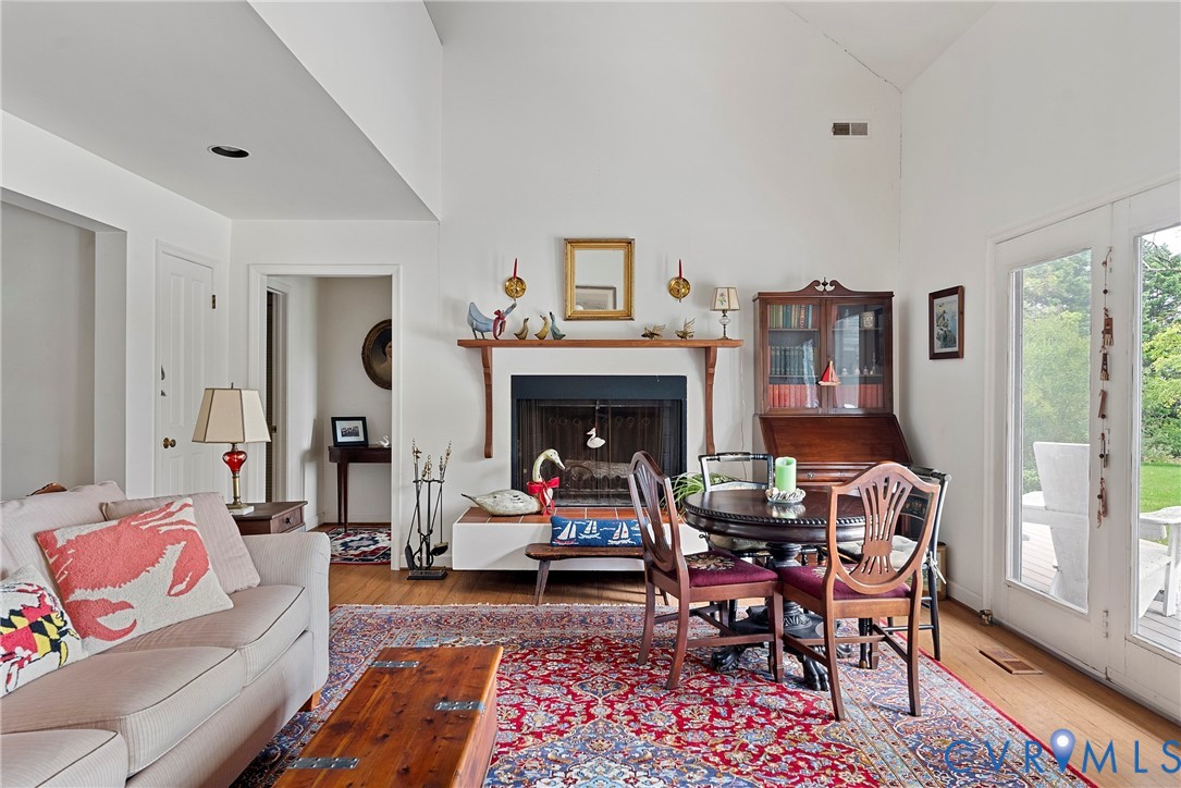 448 McSwain Road White Stone, VA 22578 - Photo 21 of 50 Living area featuring a fireplace, light wood-styl