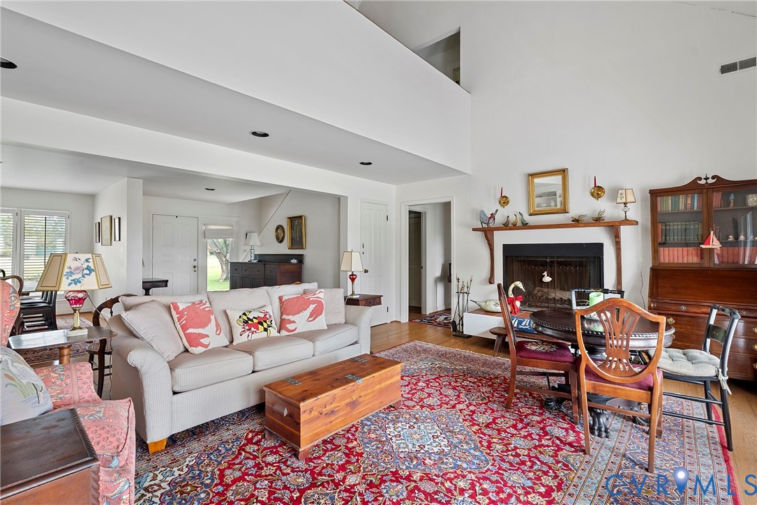 448 McSwain Road White Stone, VA 22578 - Photo 22 of 50 Living room with a fireplace, wood finished floors
