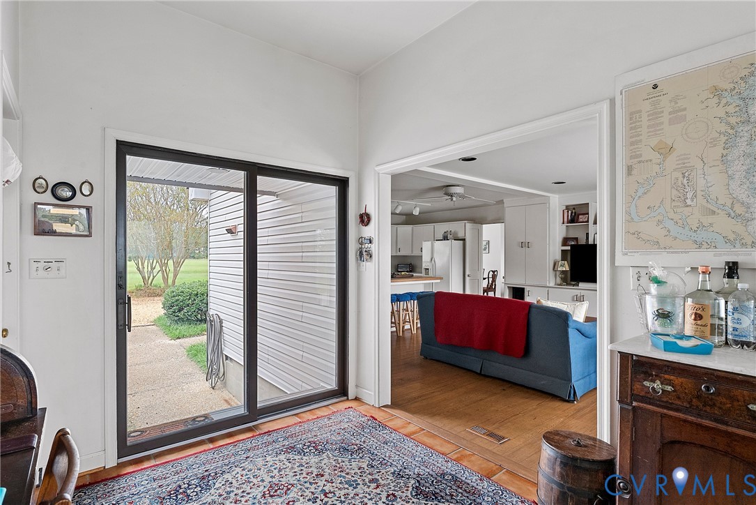 448 McSwain Road White Stone, VA 22578 - Photo 34 of 50 Doorway to outside featuring wood finished floors