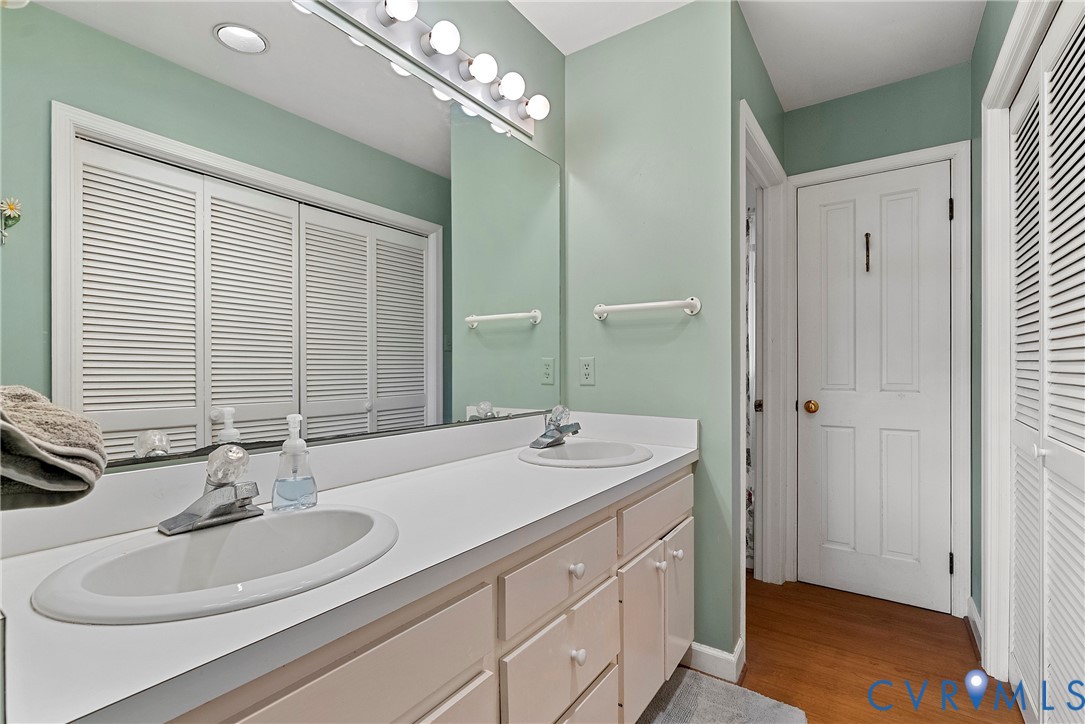 448 McSwain Road White Stone, VA 22578 - Photo 38 of 50 Bathroom featuring a closet, double vanity, and li