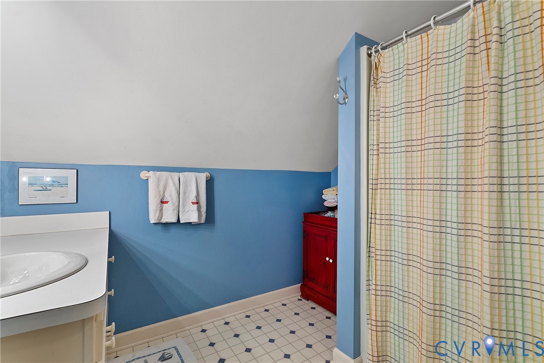 448 McSwain Road White Stone, VA 22578 - Photo 42 of 50 Bathroom featuring vanity, vaulted ceiling, and cu