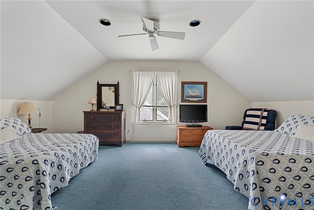 448 McSwain Road White Stone, VA 22578 - Photo 44 of 50 Bedroom with vaulted ceiling, carpet floors, and a