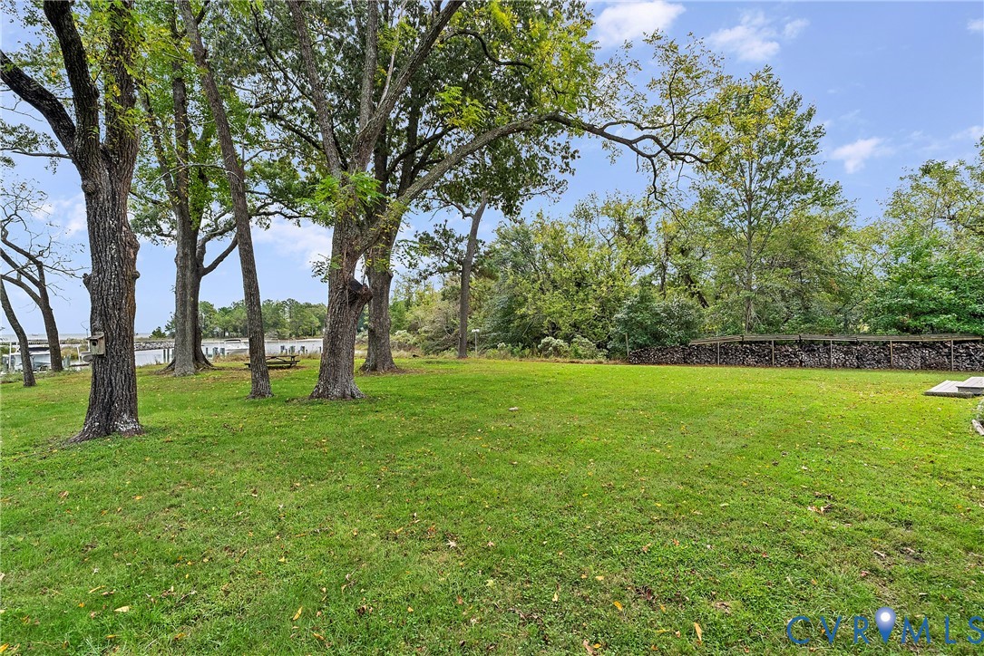 448 McSwain Road White Stone, VA 22578 - Photo 47 of 50 View of green lawn featuring a water view