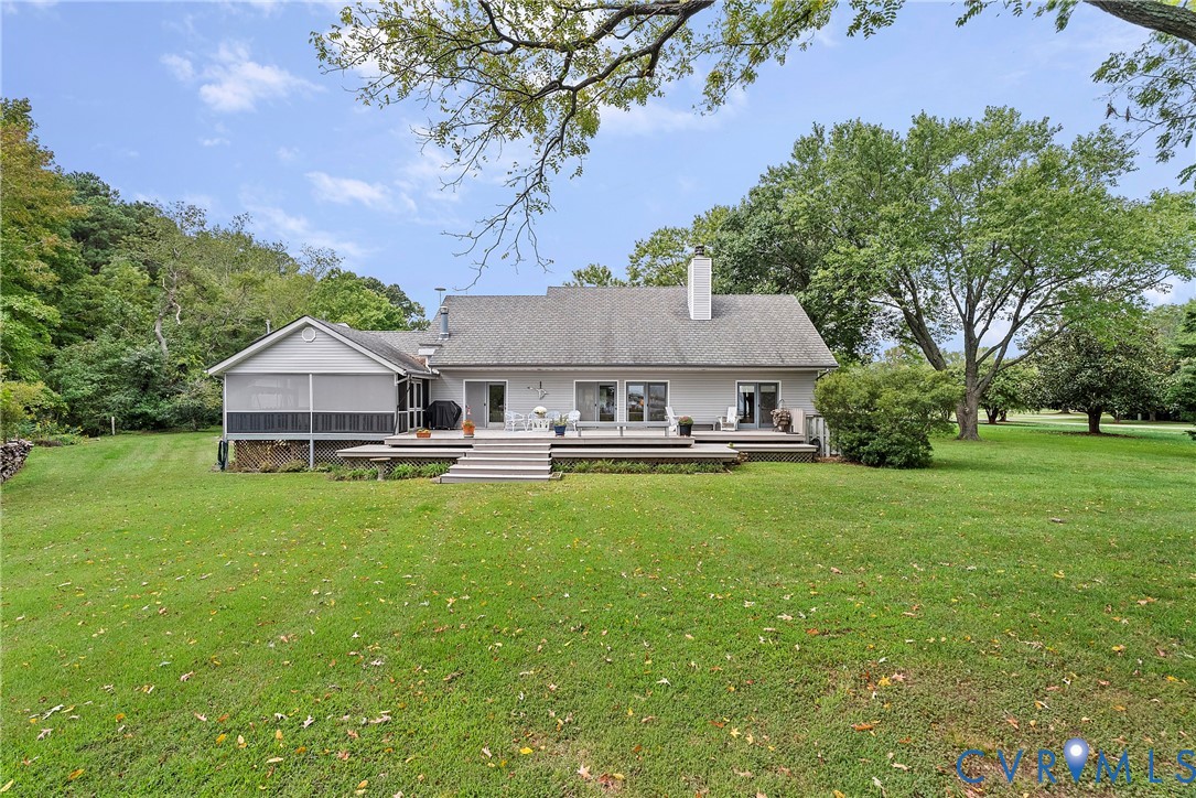 448 McSwain Road White Stone, VA 22578 - Photo 9 of 50 Back of house with a lawn, a deck, a chimney, and