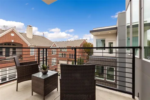 a view of a terrace with sitting area