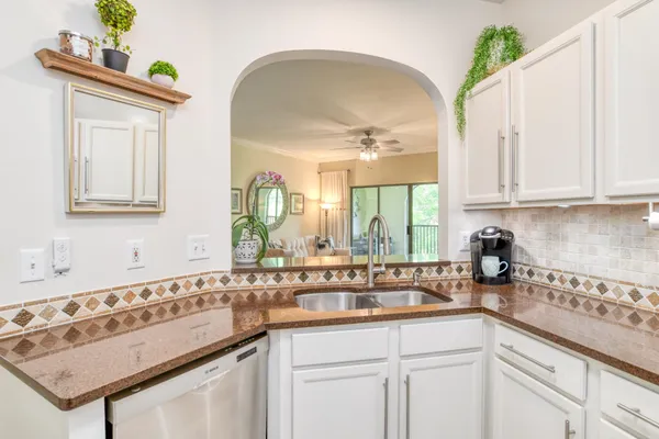 a kitchen with a sink and cabinets