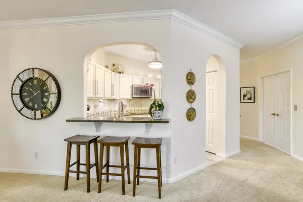 a bedroom that has a bed and a chair in it