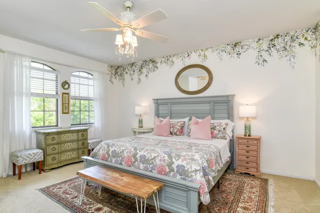a view of a hallway with wooden floor and cabinet