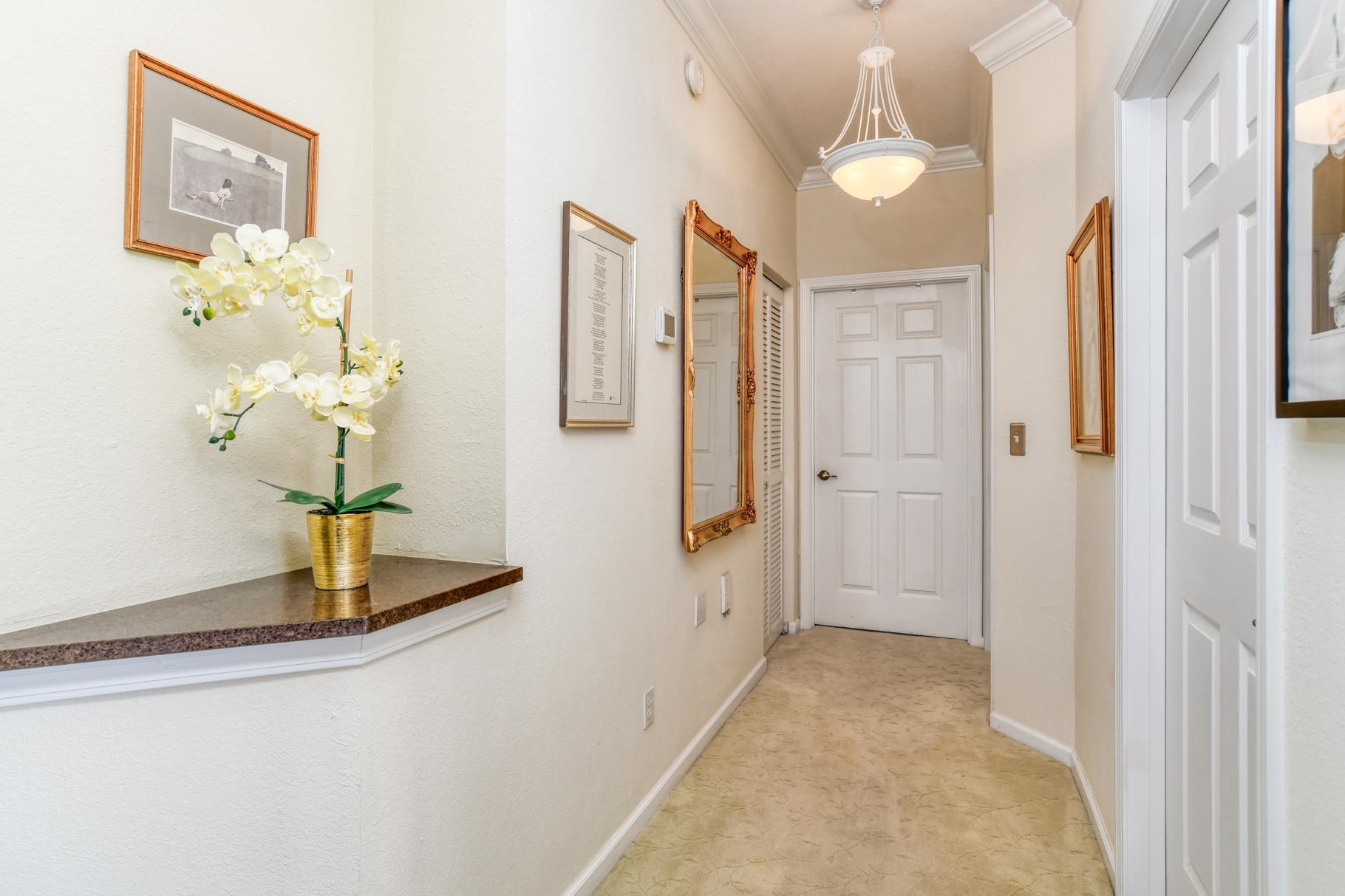 1825 Vista Cove Road St. Augustine, FL 32084 - Photo 29 of 66 a view of a hallway with wooden floor and cabinet