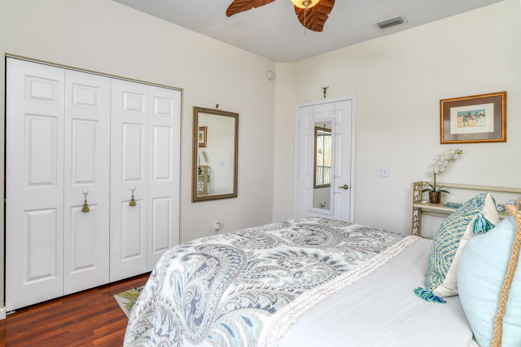1825 Vista Cove Road St. Augustine, FL 32084 - Photo 31 of 66 a bedroom with a bed and wooden floor